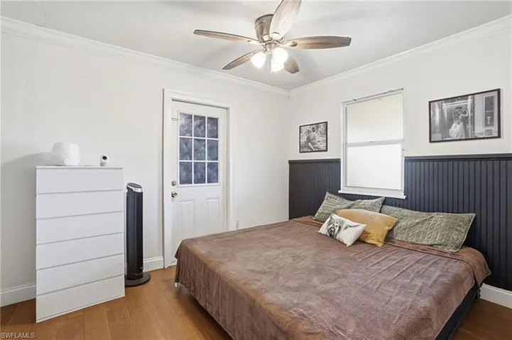 Bedroom featuring wood-finish flooring and a ceiling fan
