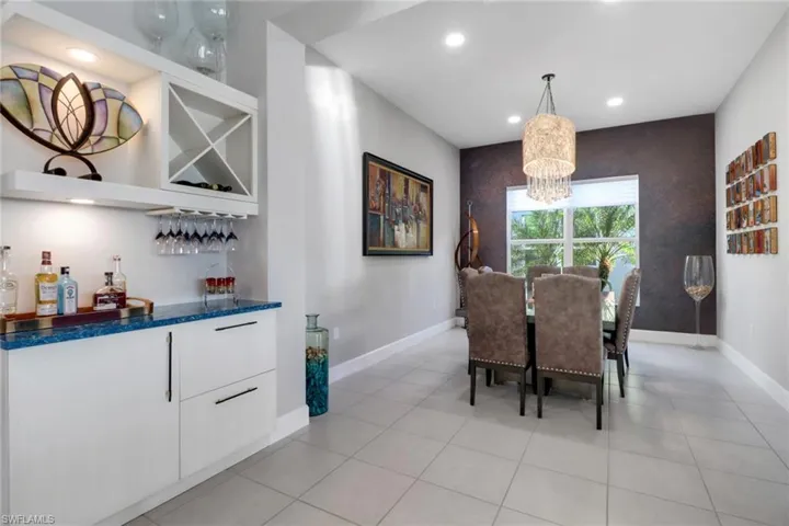 Dining room; Built-in dry bar with custom cabinetry and under-cabinet lighting