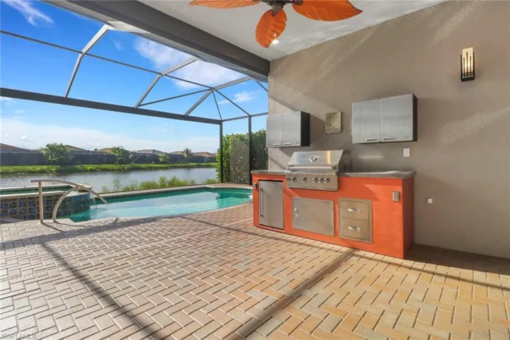 Lanai equipped with a complete summer kitchen and retractable hurricane screen