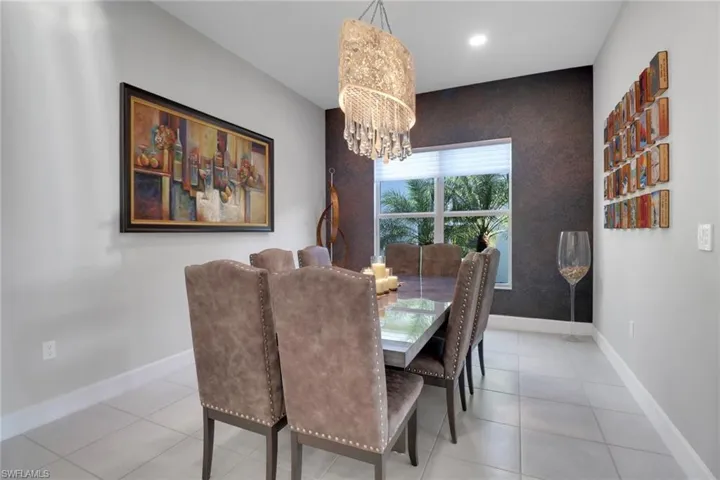Formal dining room with a statement  chandelier