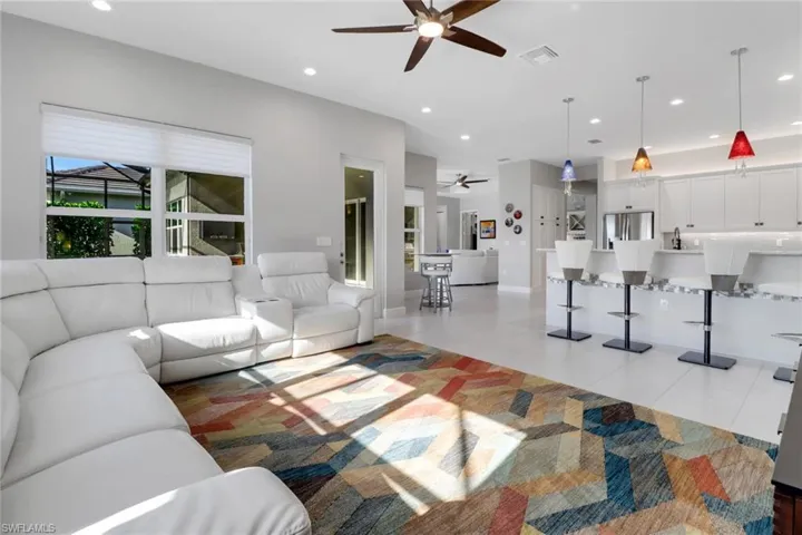 Spacious family room with abundant windows and a door leading to the lanai