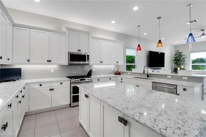 Gourmet kitchen with spacious island, eat-at countertops, and abundant pull-out drawers