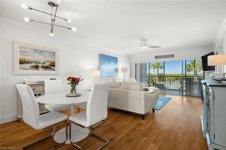 Dining room open to the living room overlooking the waterfront