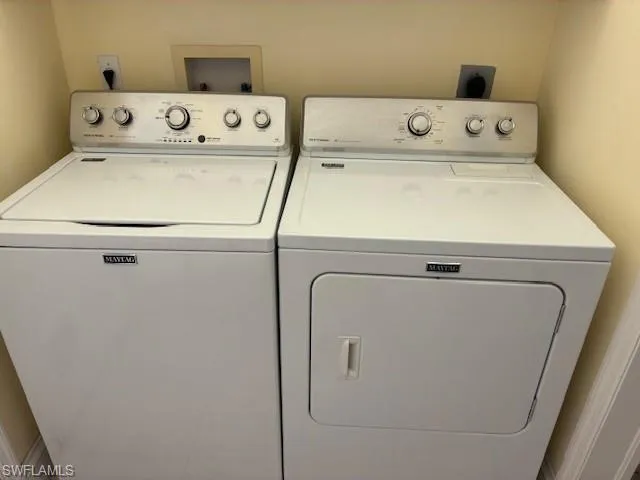 Laundry area featuring separate washer and dryer