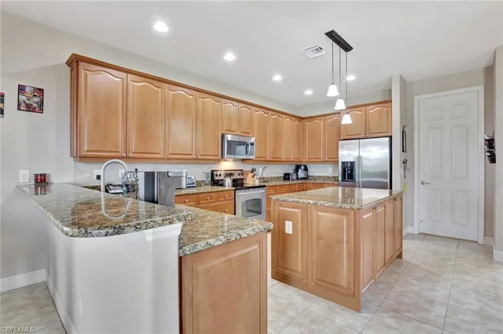Kitchen has wide breakfast bar