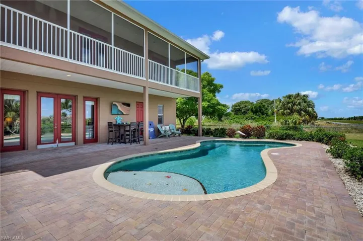 Pool, screened porch and sun deck