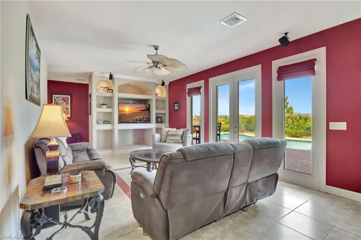 1st floor living room with pool view