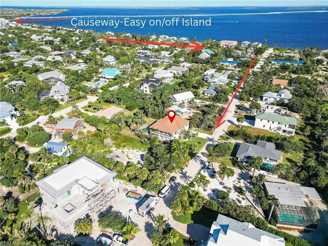 Aerial view of property's location featuring a nearby body of water and convenient on/off island access - East End!