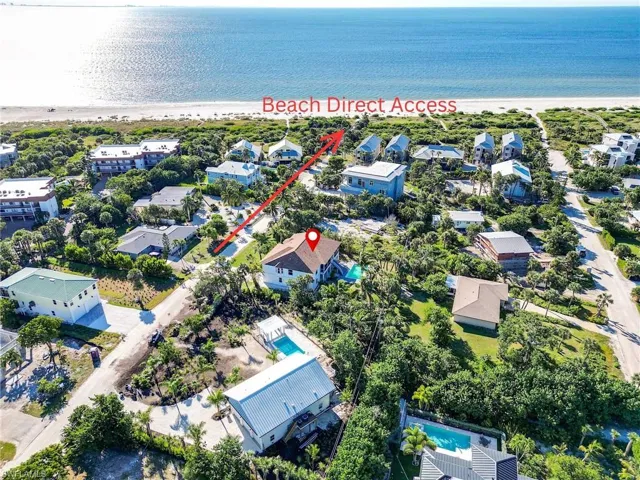 Drone / aerial view of waterfront with a beach