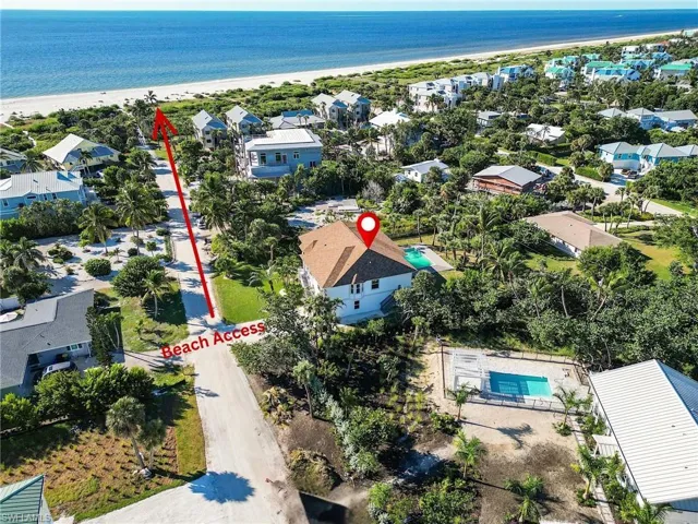 Aerial view of convenient beach access featuring unending shoreline