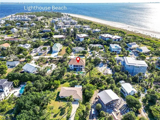 Aerial perspective of suburban area with unending shoreline
