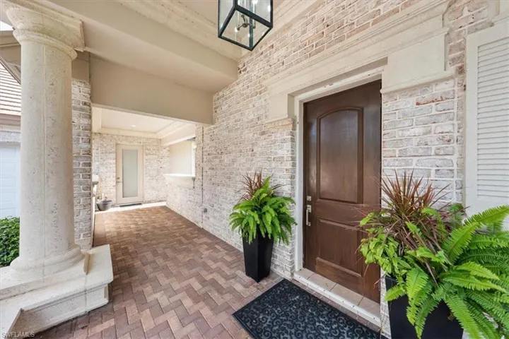 Property entrance with brick siding