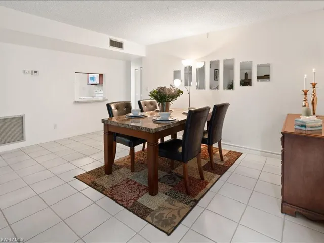 Dining room featuring light tile patterned floors