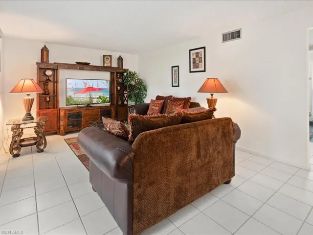 Living area with and light tile patterned floors