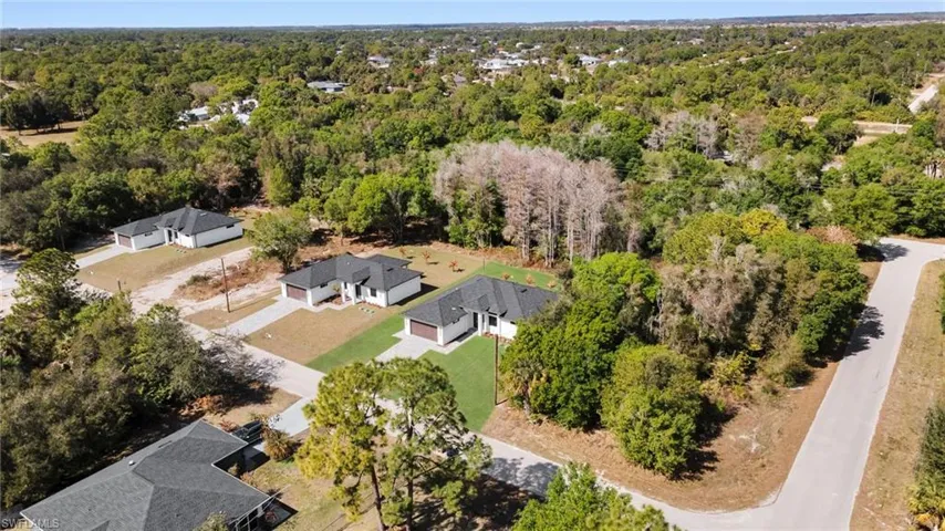 Aerial view of residential area with a forest