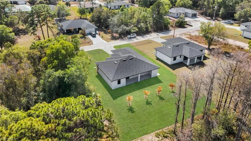 Aerial view of residential area with a tree filled landscape