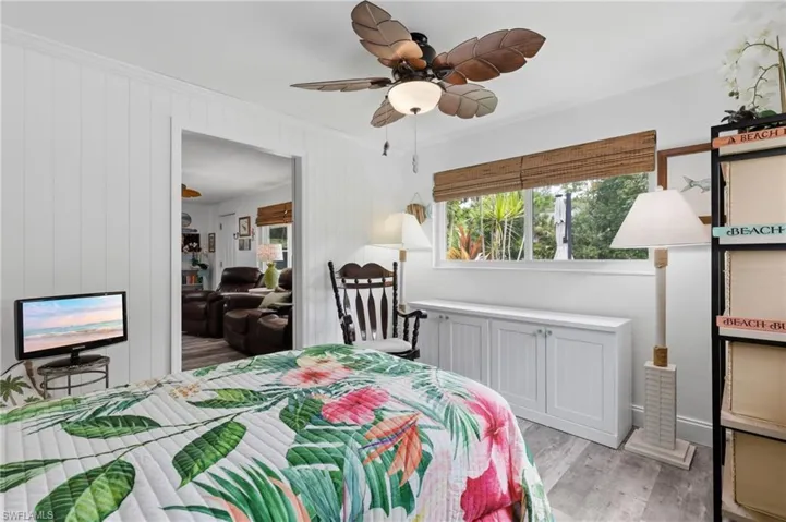 Room featuring LVP flooring and white shiplap paneling