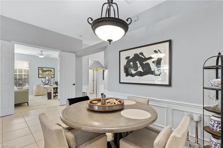 Tiled dining area featuring ceiling fan