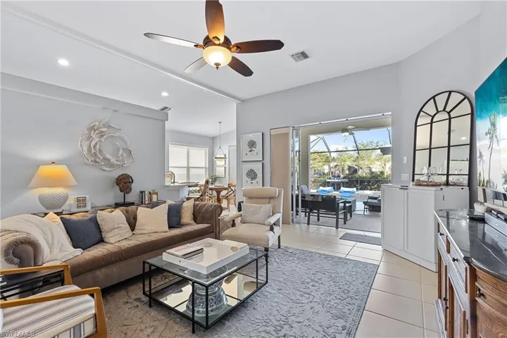 Tiled living room with ceiling fan