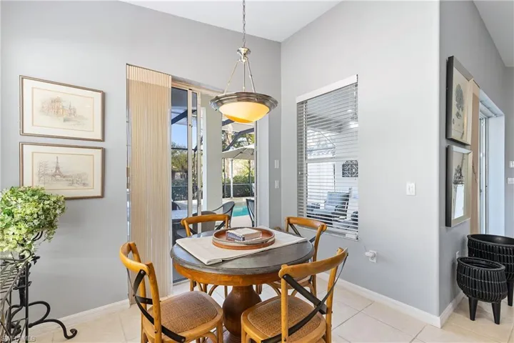 Dining area with light tile patterned floors