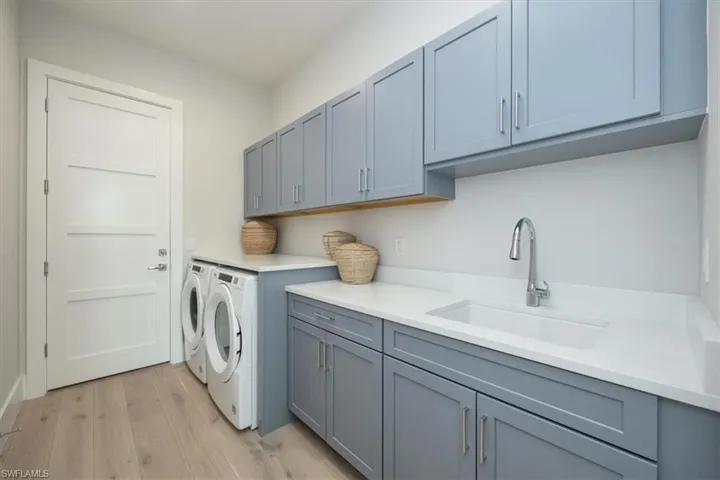 Such a fun and functional laundry room! Deep laundry sink, side-by-side W/D, and counter space from end to end.
