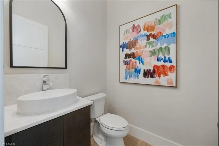 The powder bath is tucked away just off of the great room and adjacent to the office.