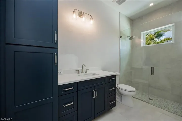 Bathroom 3 with direct access from bedroom three and the pool deck.