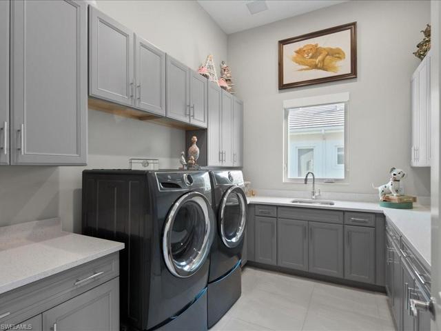 Laundry Room W/ Electrolux W&D