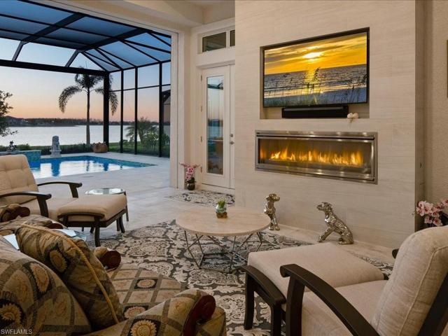 Outdoor Living W/ Fireplace & TV On Custom Tiled Wall