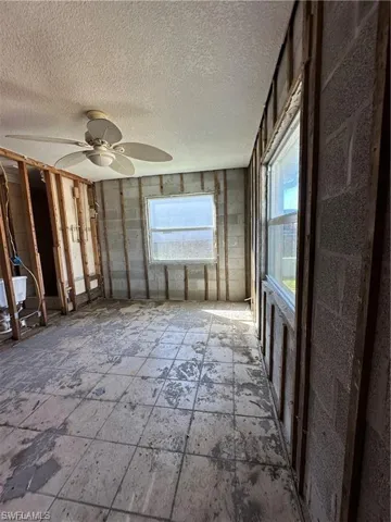 Unfurnished sunroom with healthy amount of natural light