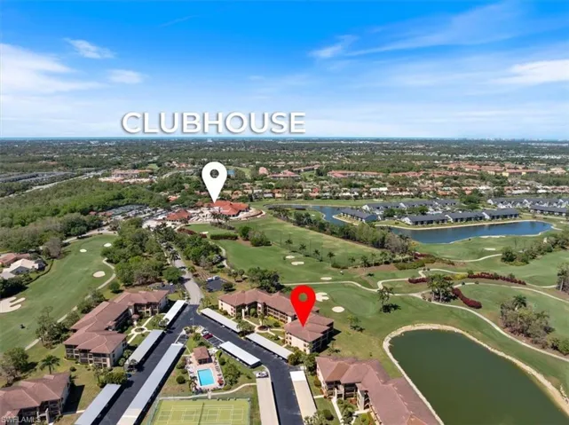 Aerial view with golf course view and a water view