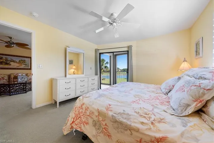 Bedroom featuring baseboards, a ceiling fan, carpet, and access to outside