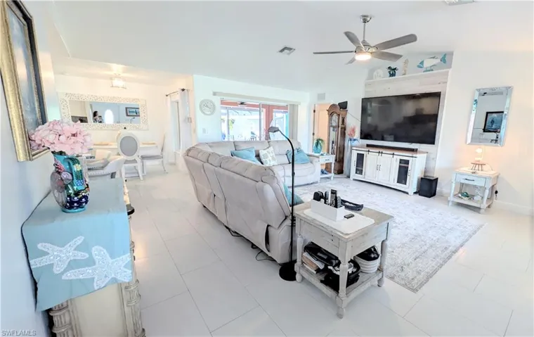 Freshly Painted!Open-concept living area with light-toned tile flooring throughout
