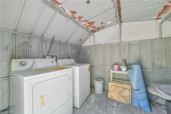 Laundry room featuring washer and dryer and laundry area