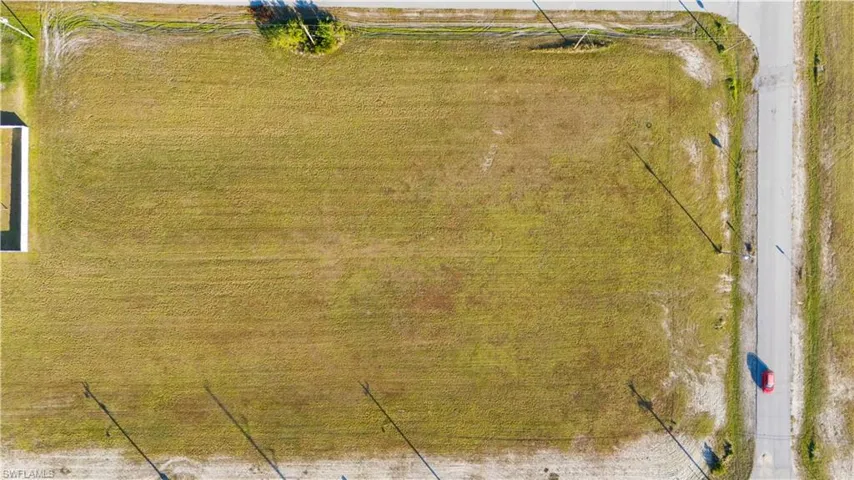 Expansive rectangular lot featuring natural grass and clear boundaries