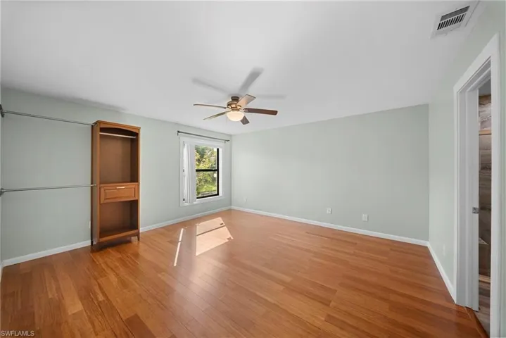 Unfurnished bedroom with light wood-style flooring and ceiling fan