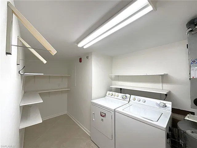 In Unit Laundry Room with shelving.