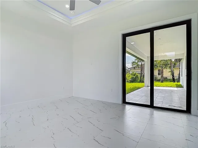 Empty room with marble finish floors, ceiling fan, and recessed lighting