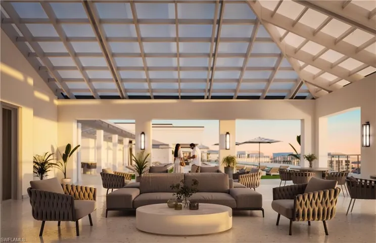 Community lobby featuring high vaulted ceiling and beamed ceiling