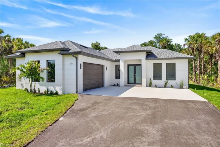 Contemporary single-story residence with a white stucco exterior