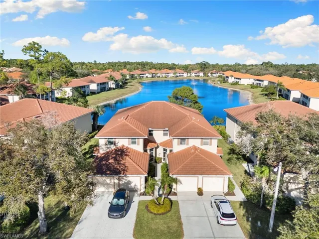 Aerial perspective of suburban area with a large body of water