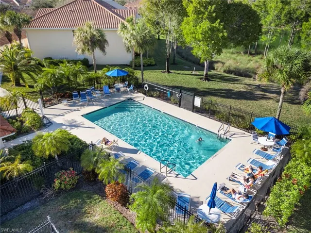 Community pool with a patio area