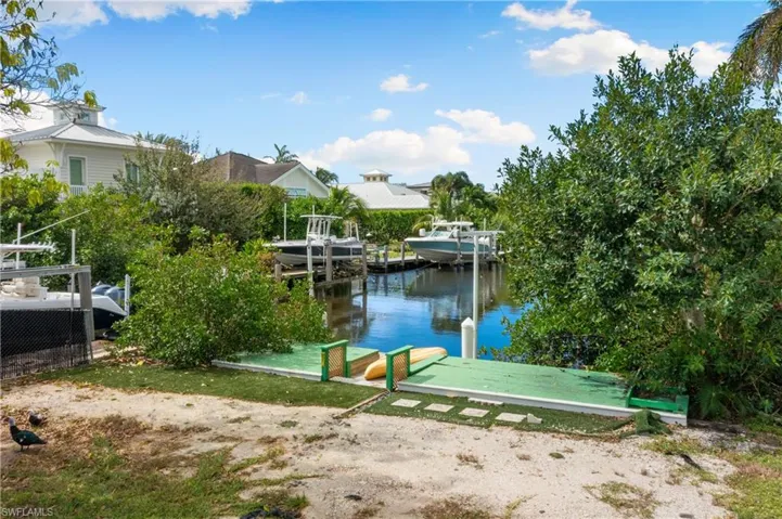 Dock area featuring a water view and boat lift