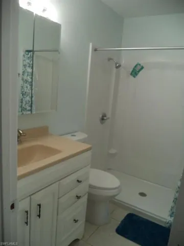 Full bathroom featuring vanity and toilet