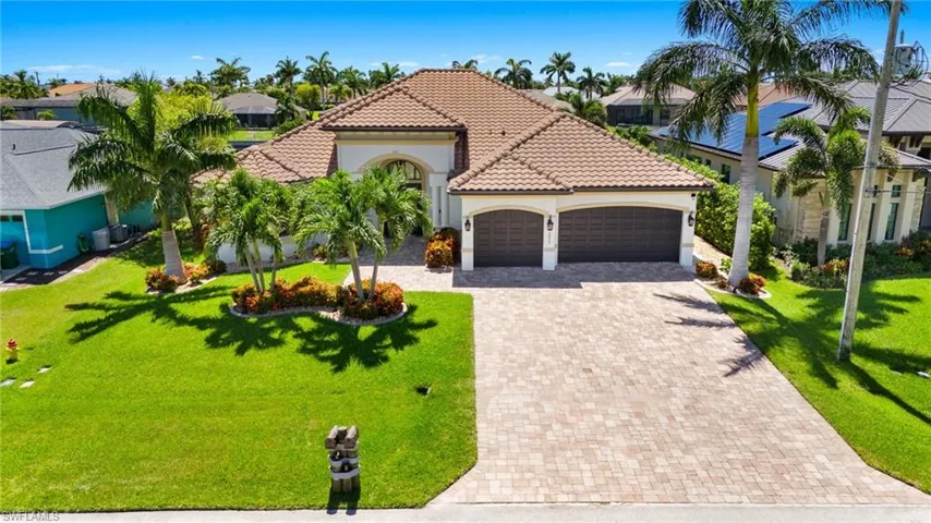 3 Car Garage and Paved Driveway.