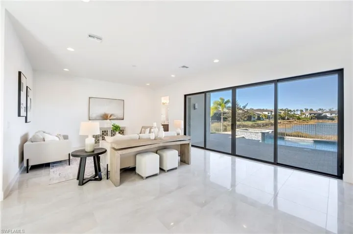 Spacious family room with pool & long lake views