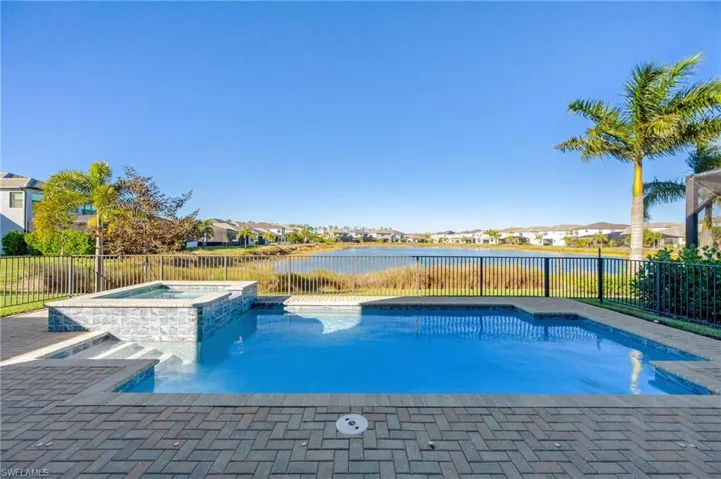 Custom pool & spa with lake views beyond