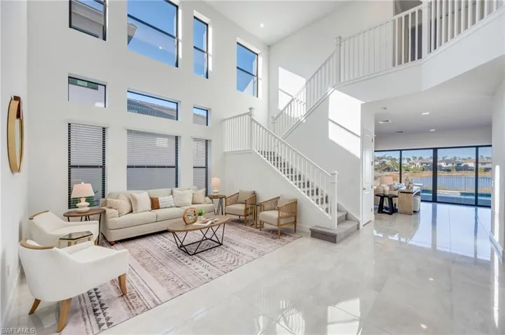 Sunlight interior with pool & long lake views.