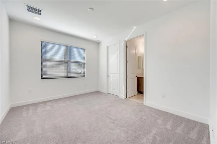Ensuite guest bedroom with full bath