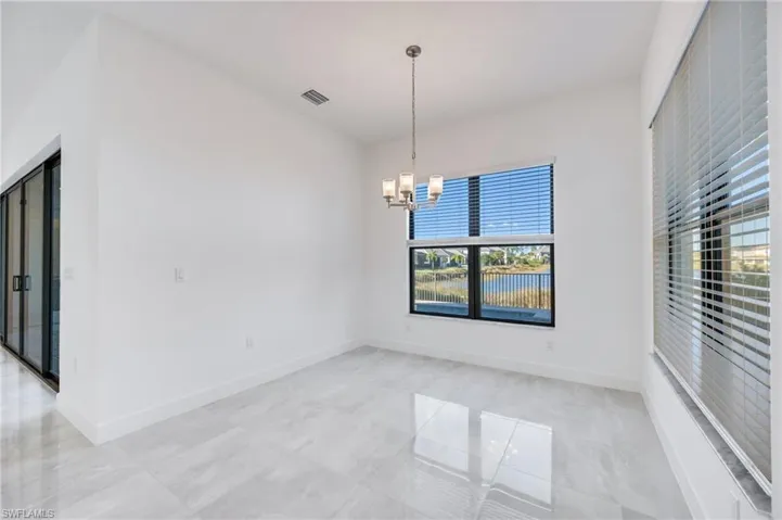 Spacious breakfast nook enjoys lake views.